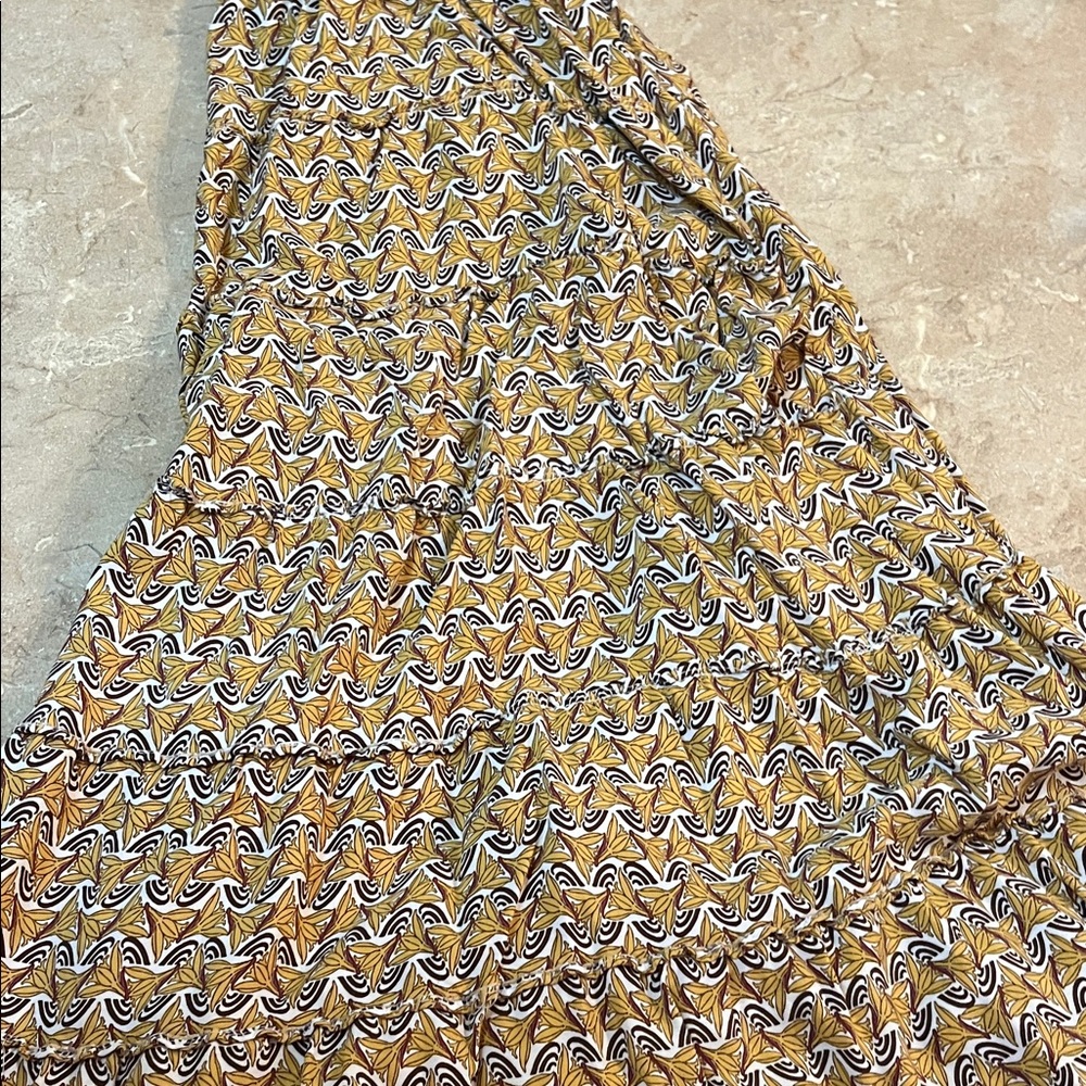 Bohemian style skirt  loose fitting and has tiers yellow and white